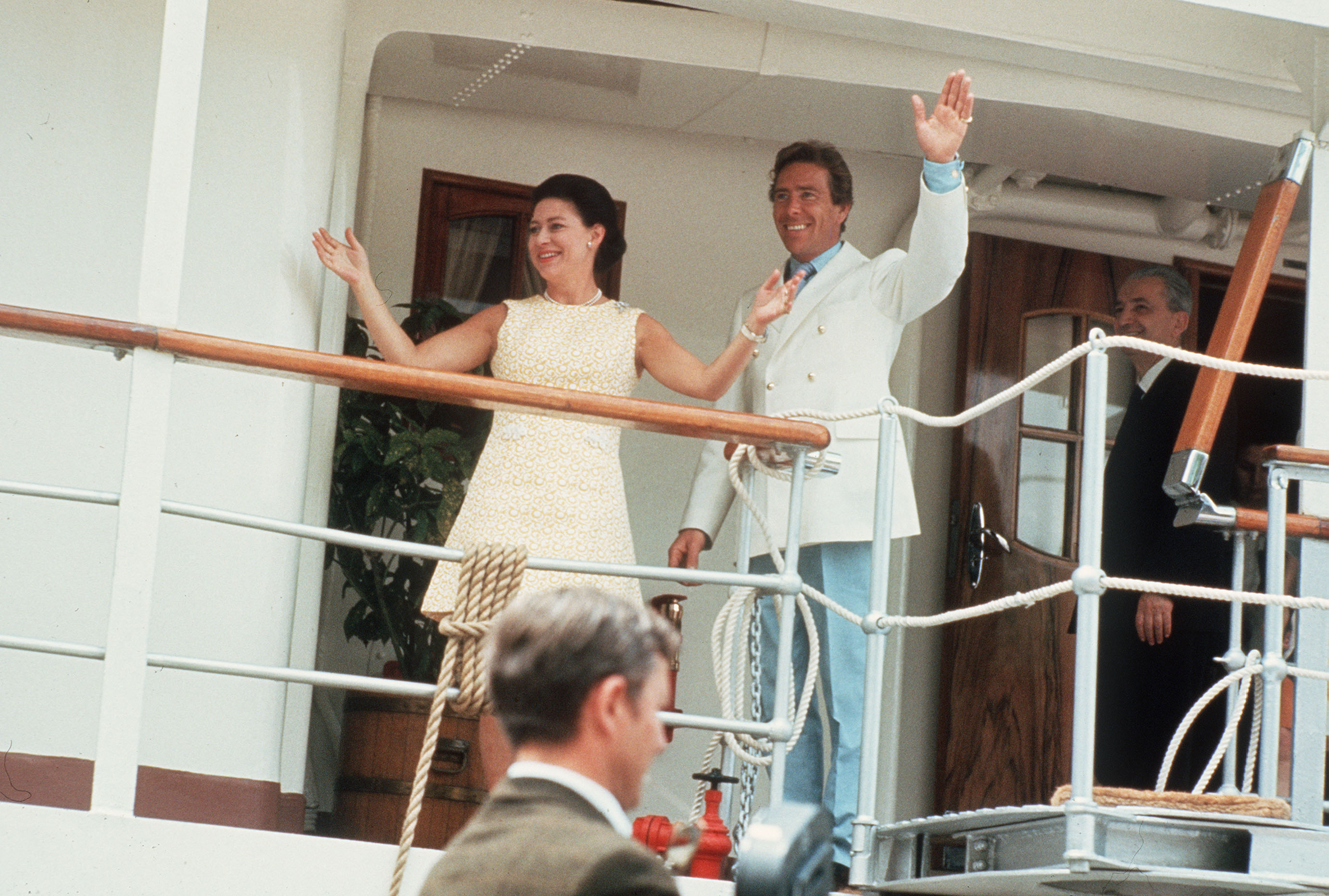 The couple wave from the deck of the Royal Yacht Britannia during their Caribbean honeymoon cruise in the West Indies in 1960