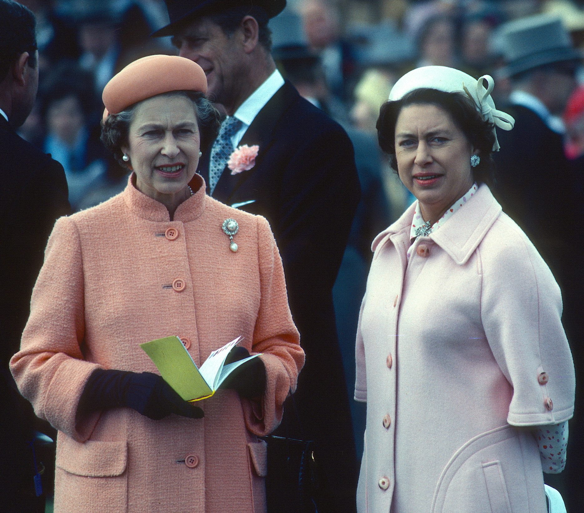 The Queen and Margaret are seen attending the Epsom Derby in Surrey in 1979, a year after Margaret was diagnosed with pneumonia overseas